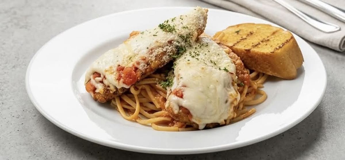Chicken Parmesan served over linguine