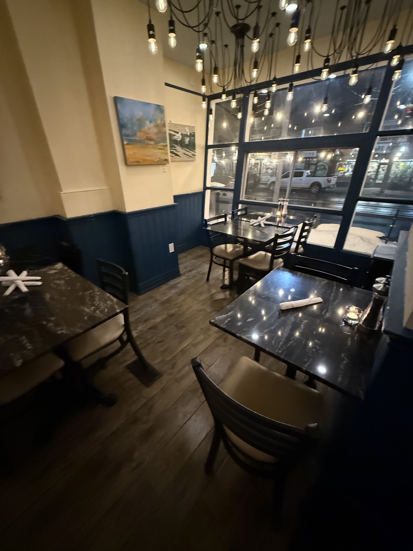 The dining room lit in the evening at Lighthouse 971