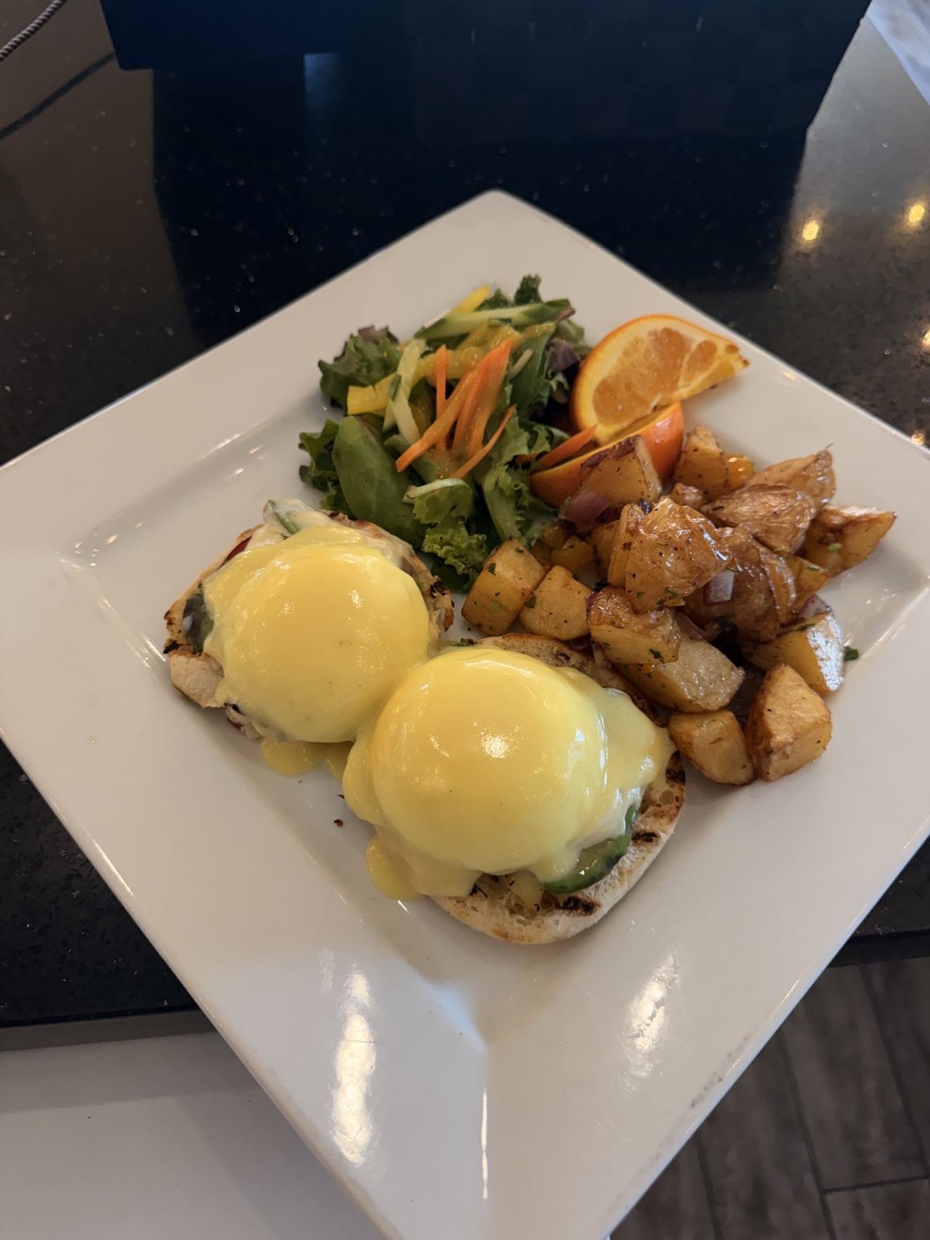 Eggs benedict brunch plate at Lighthouse 971