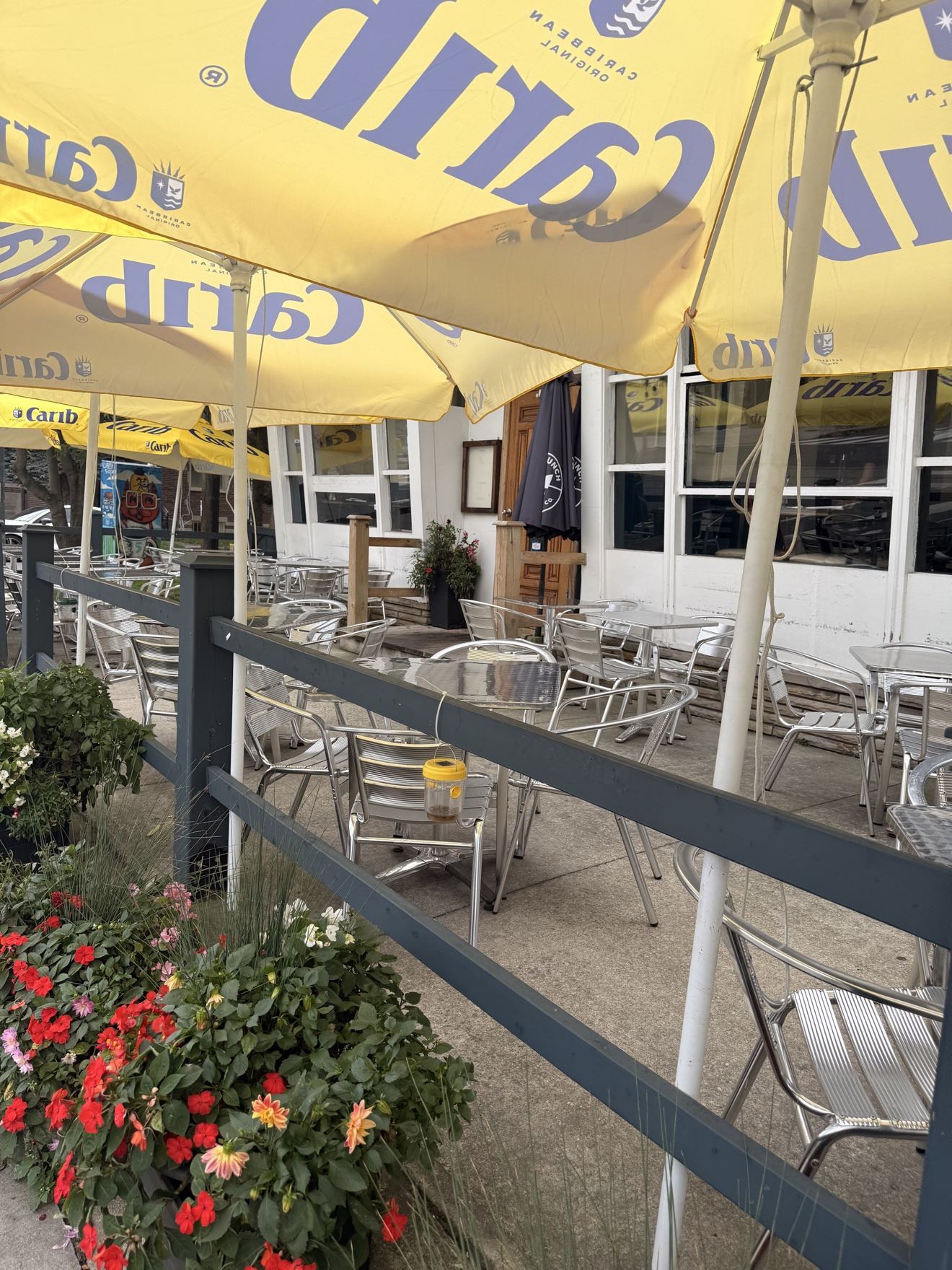 The Lighthouse 971 patio with umbrellas and string lights